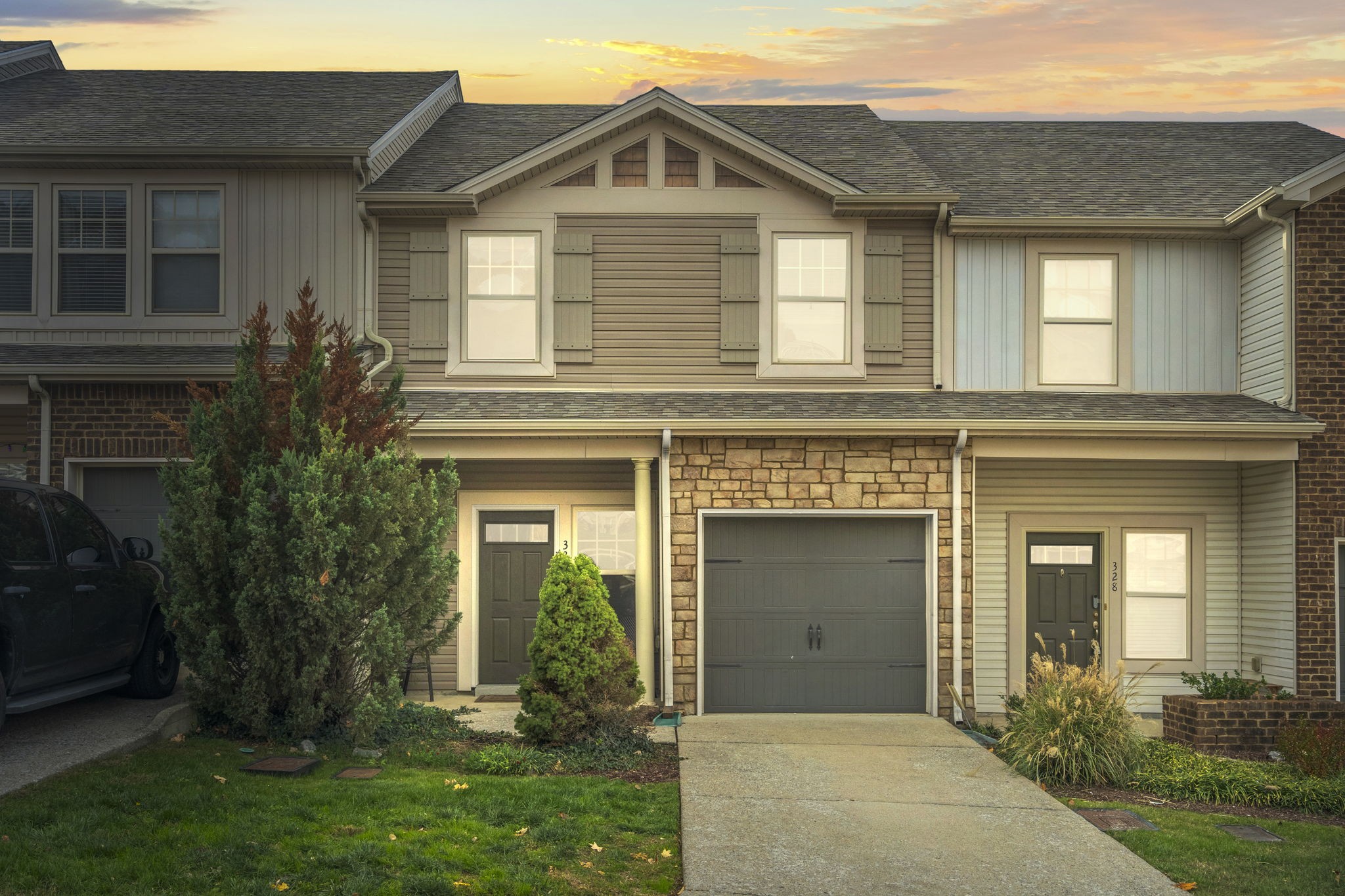 a front view of a house with garden