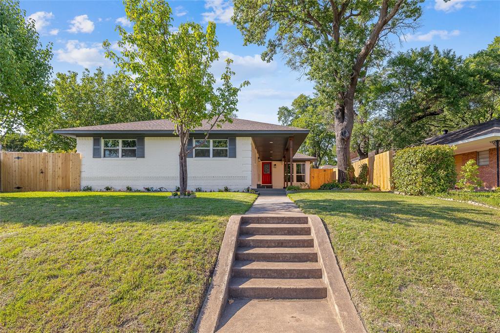 front view of a house with a yard