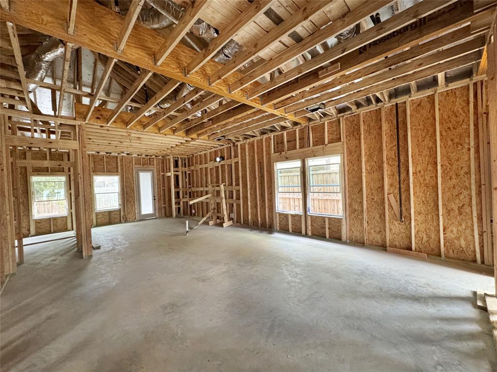 a view of an empty room with windows