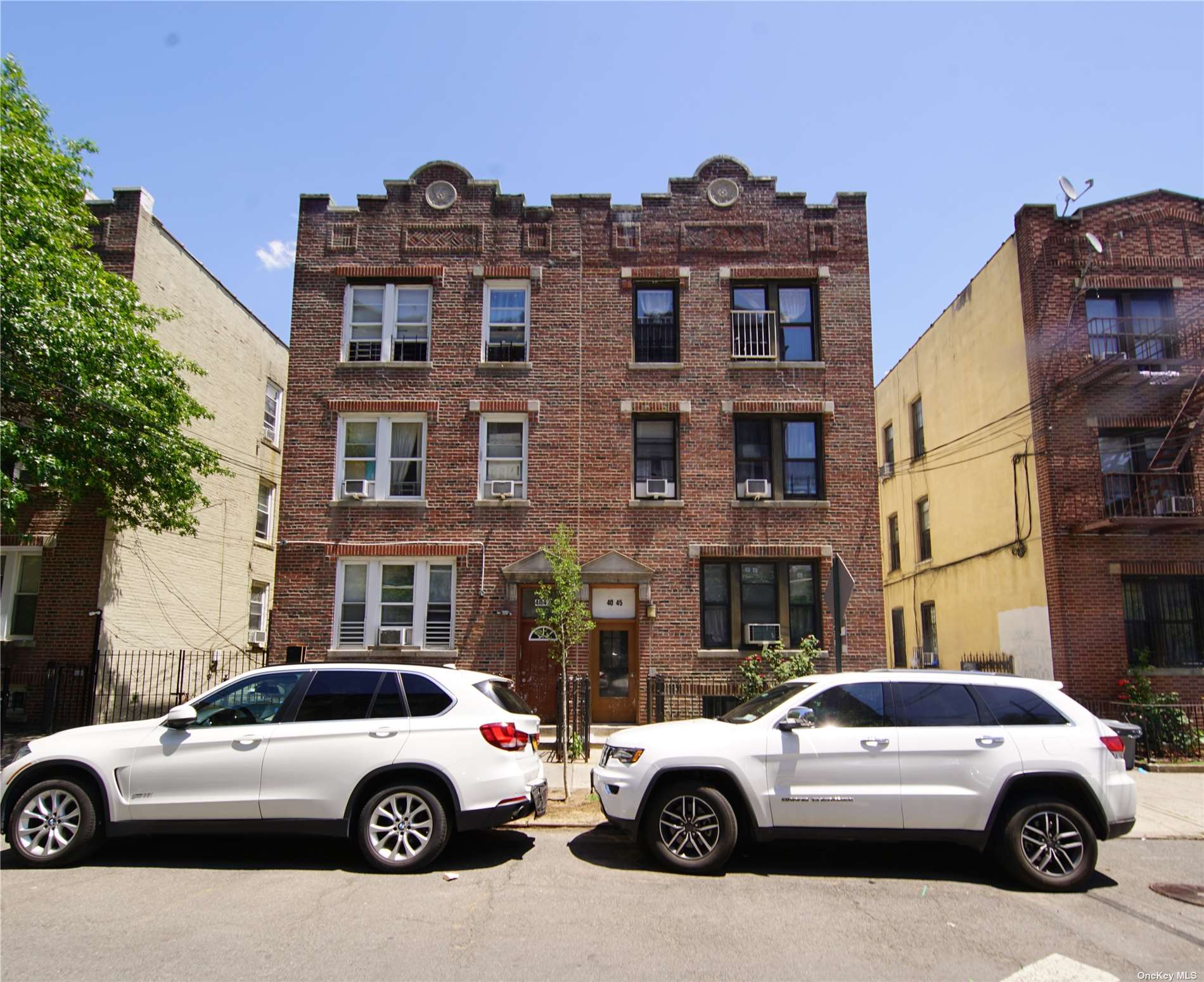 a view of a cars parked in front of a building