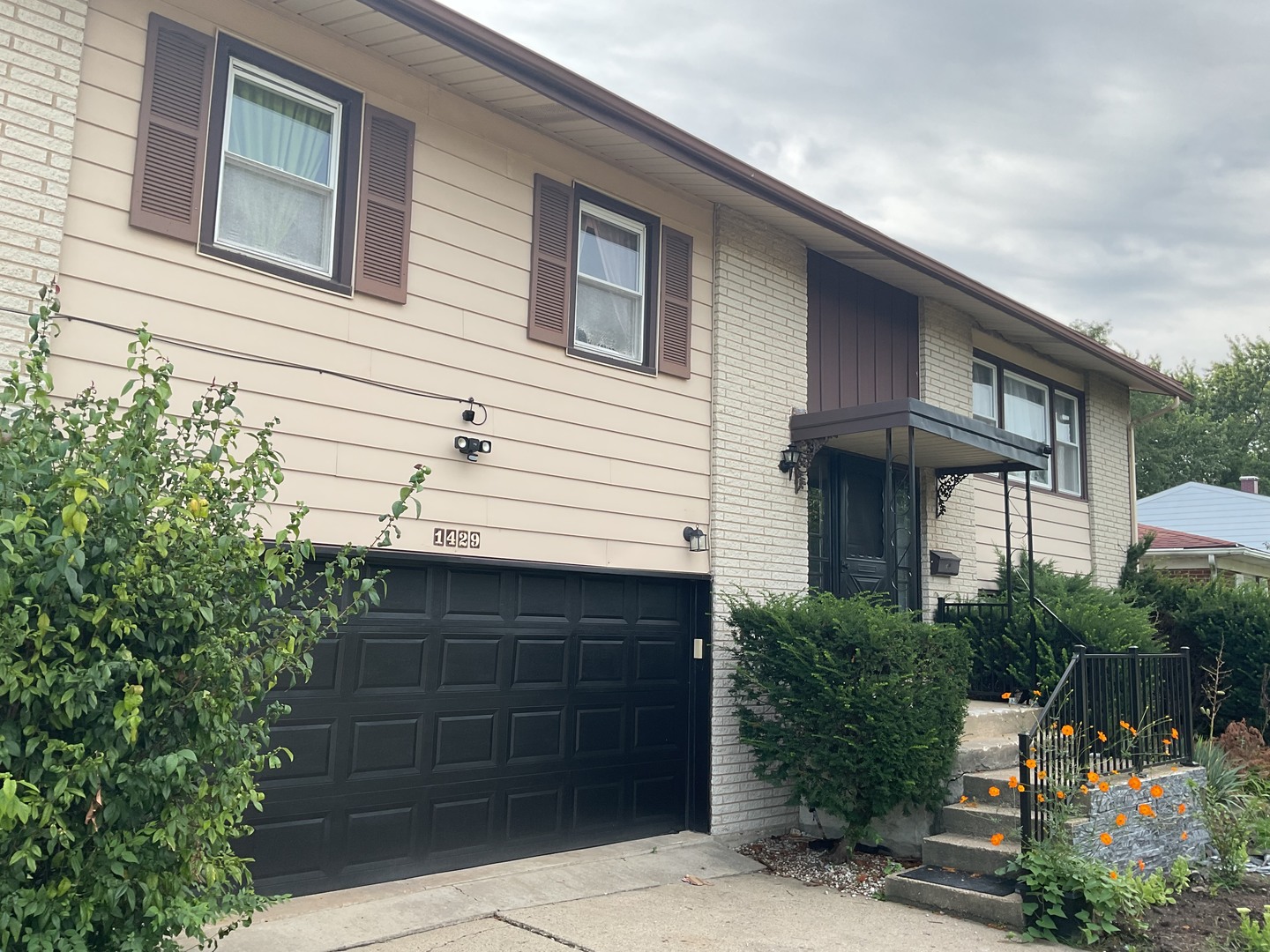 a front view of a house with a garage