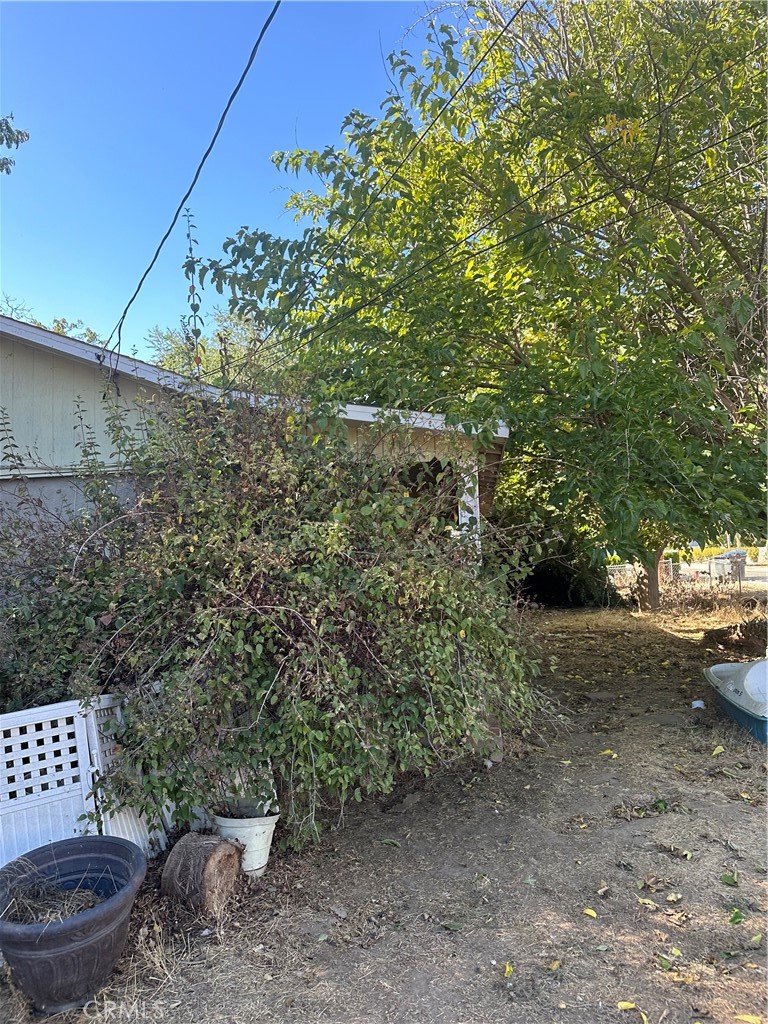 a view of a backyard of the house