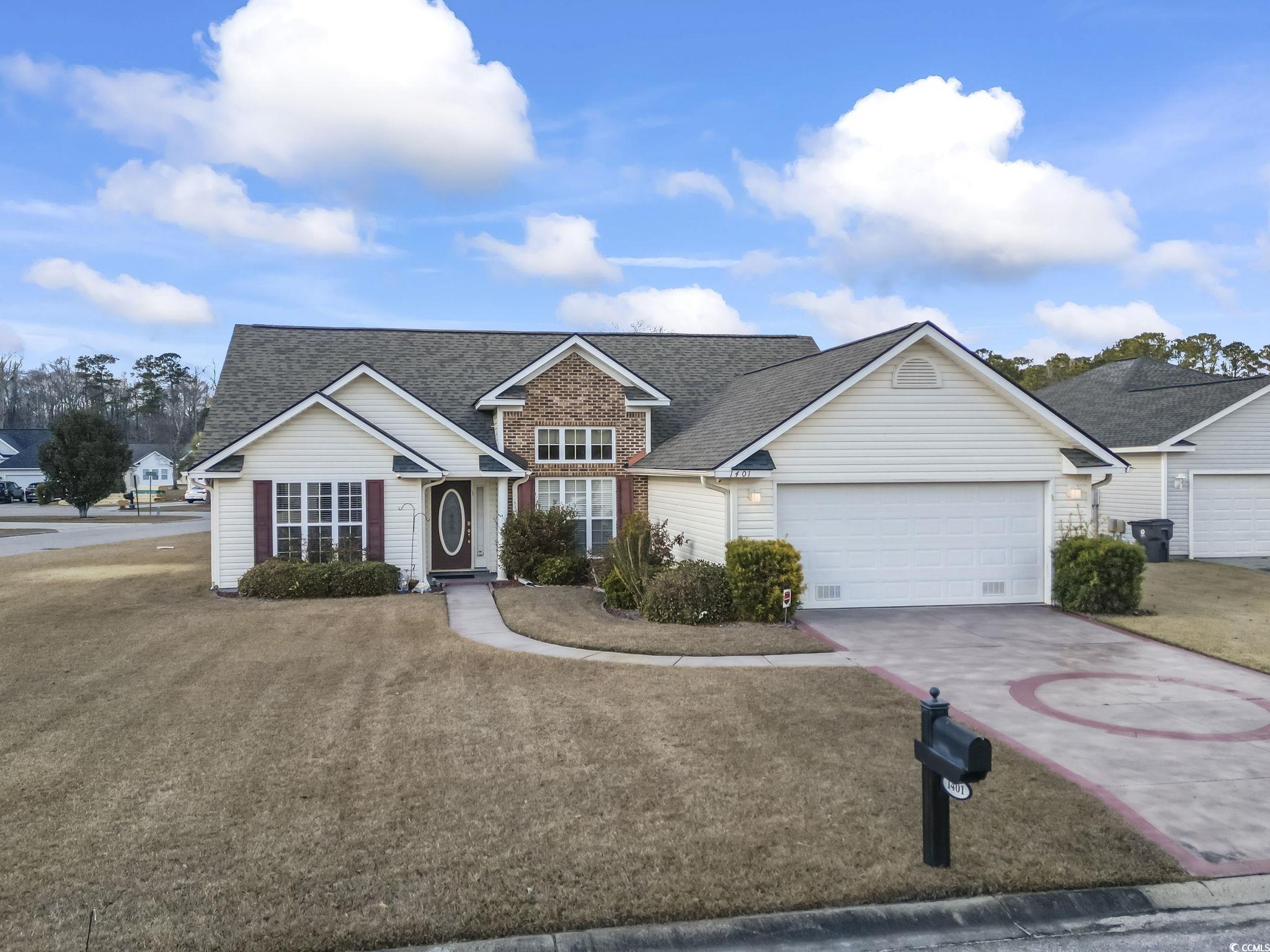 View of front of home featuring a front lawn and a