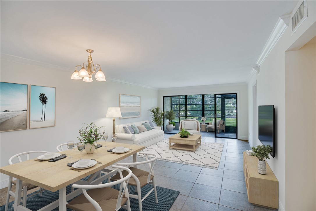 a living room with furniture a chandelier and a dining table