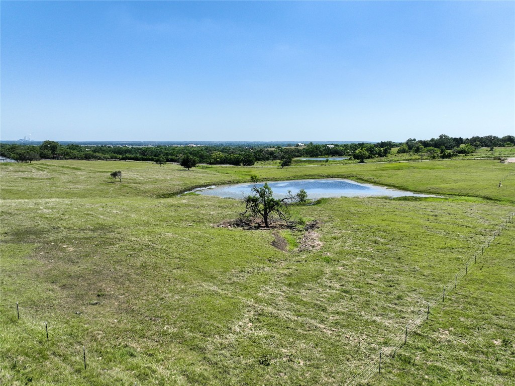 a view of a lake with a yard