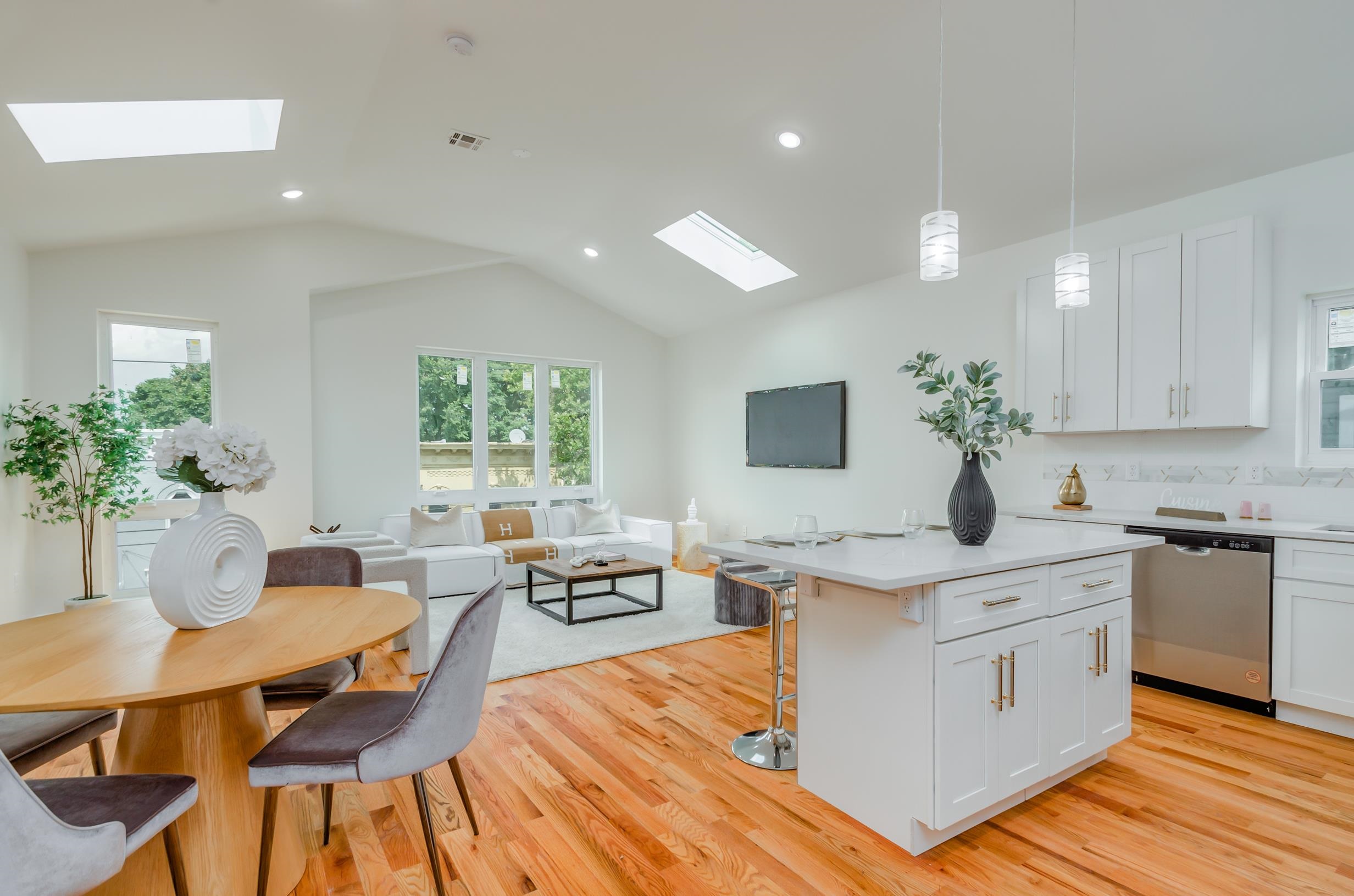 a kitchen with a table chairs stove and cabinets