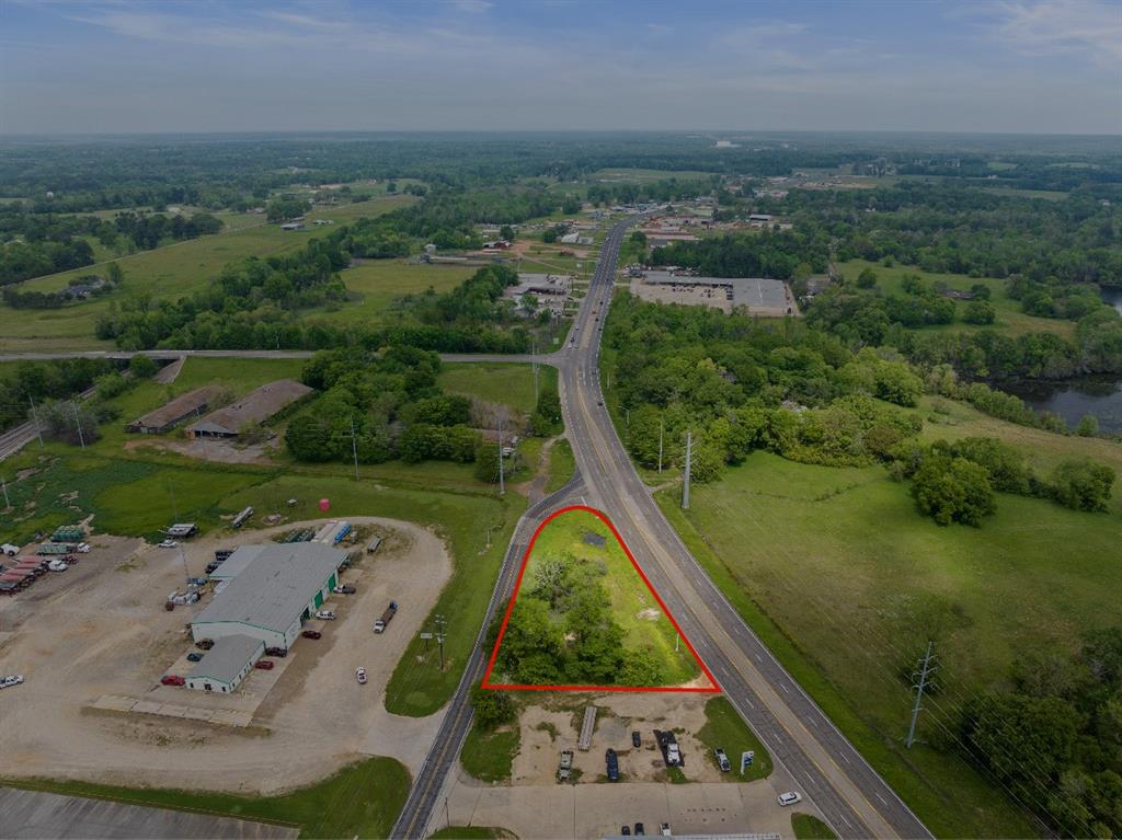 an aerial view of a residential houses with outdoor space