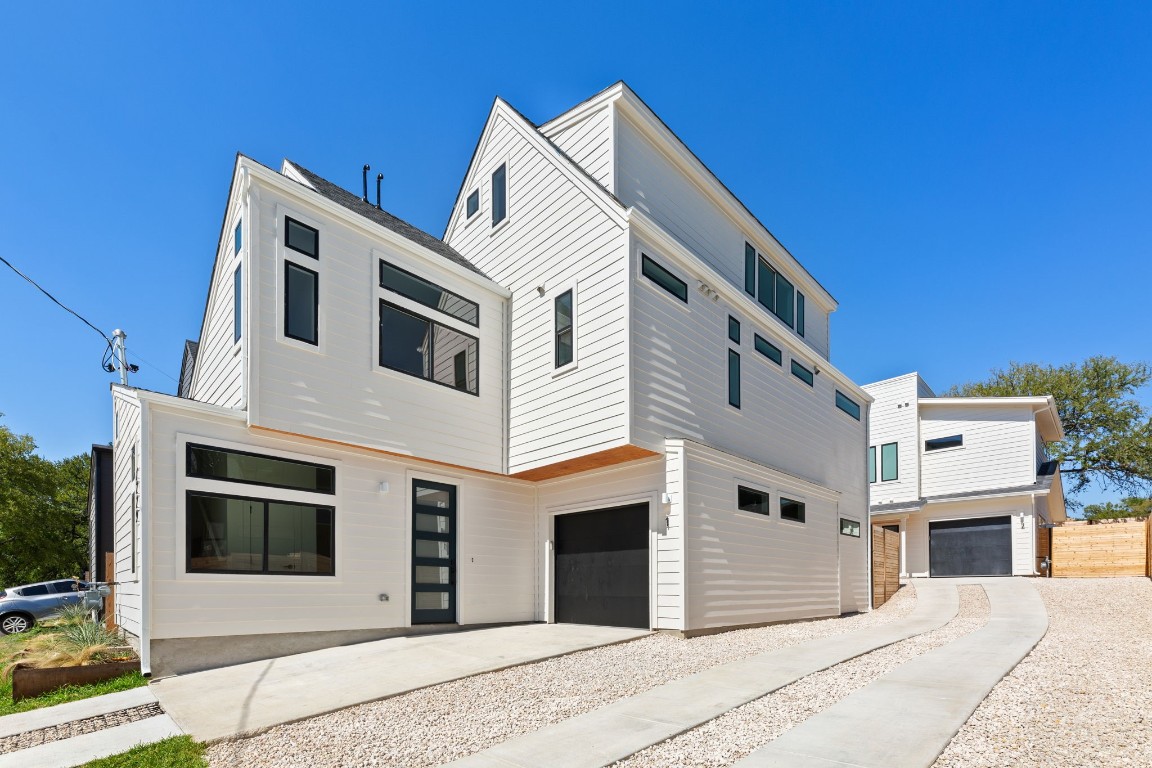 a front view of a house with a garage