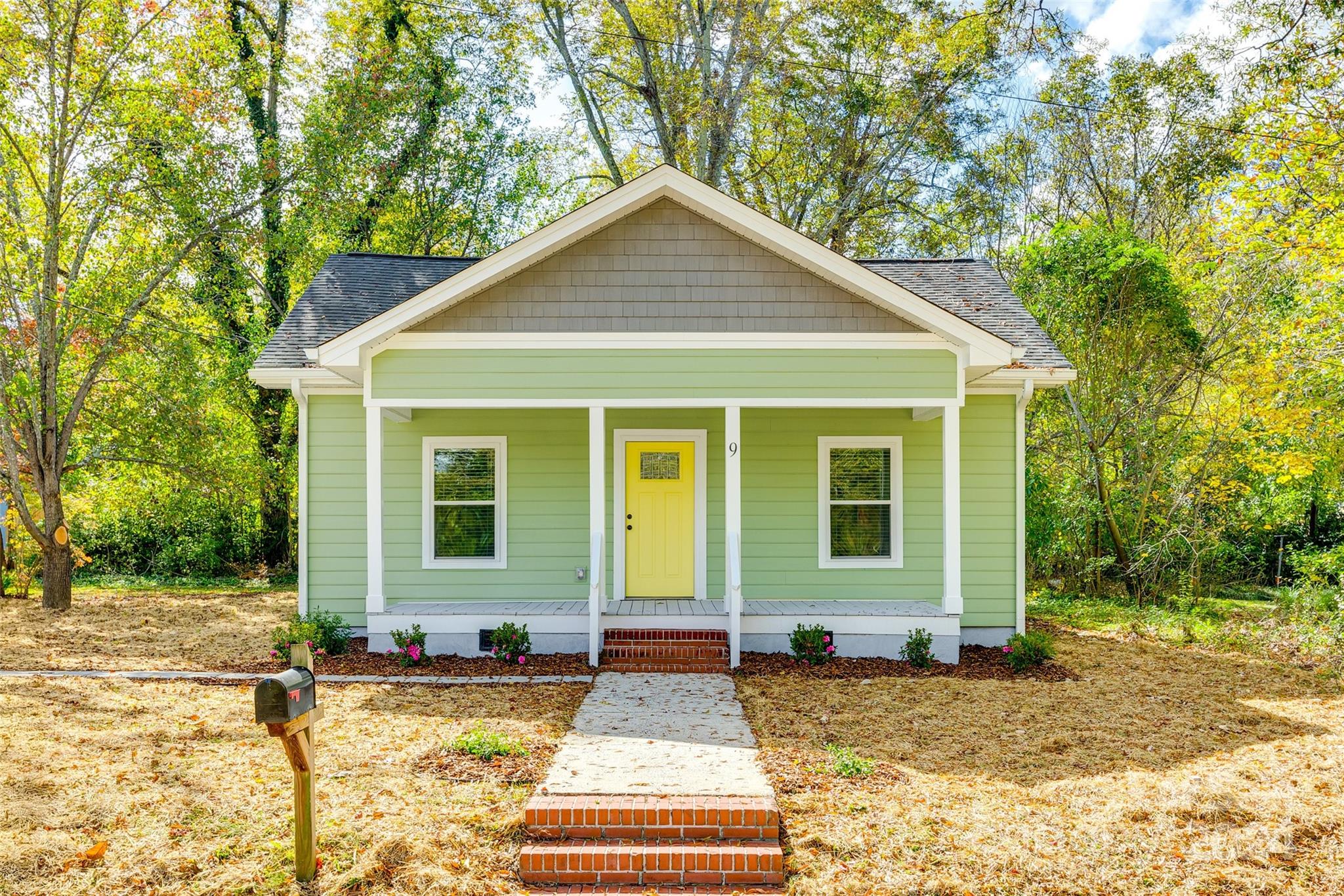 a front view of a house with garden