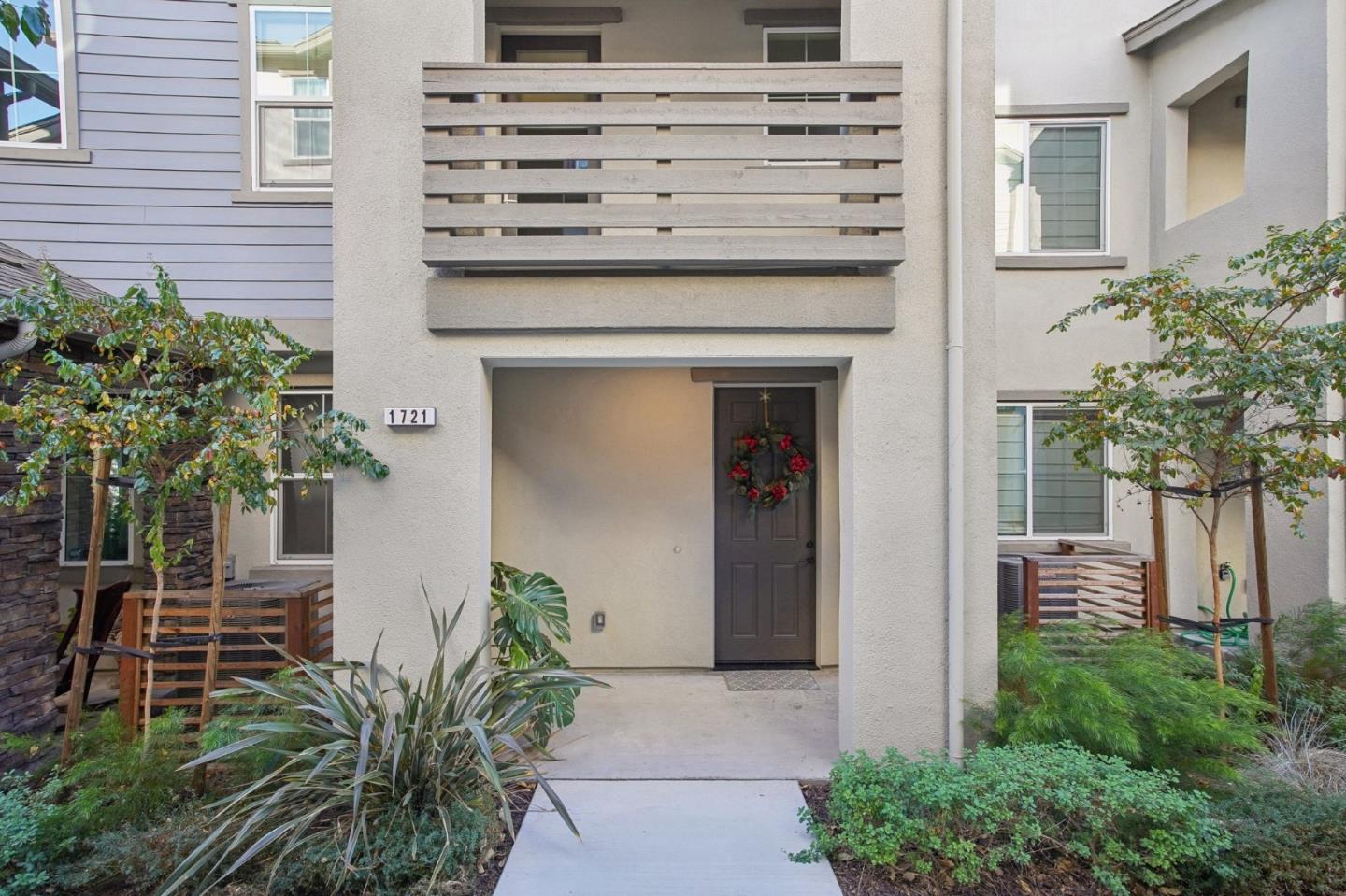 a view of front door and potted plants