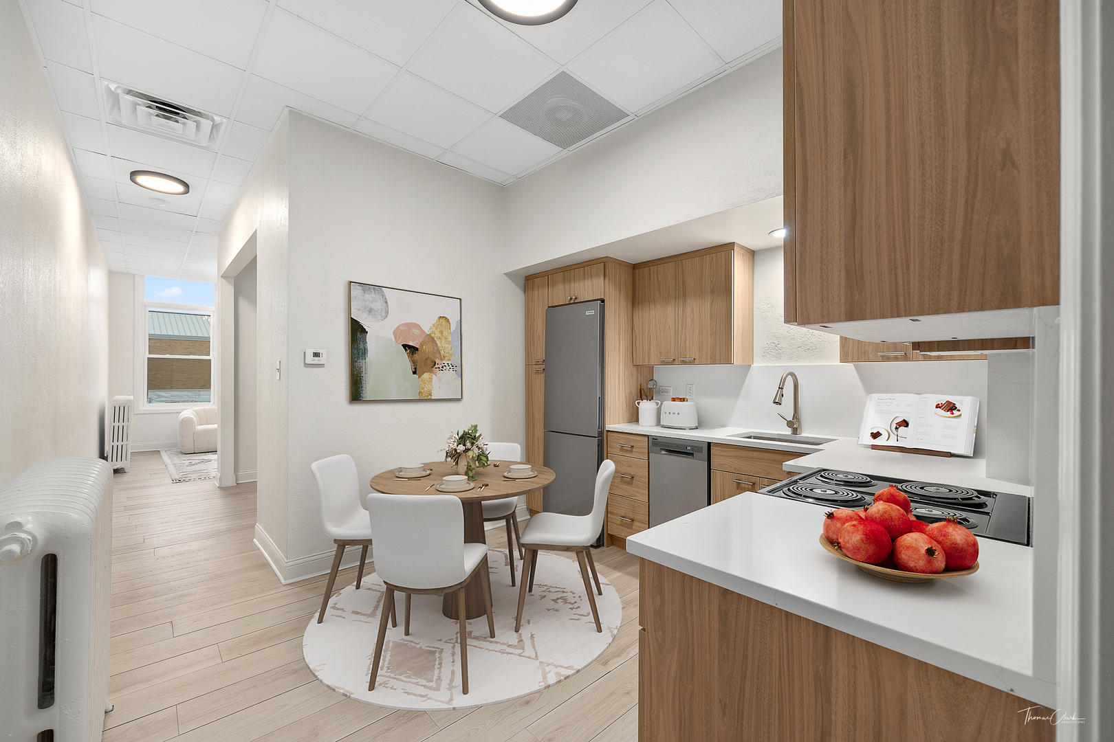 a kitchen with a sink a stove and cabinets