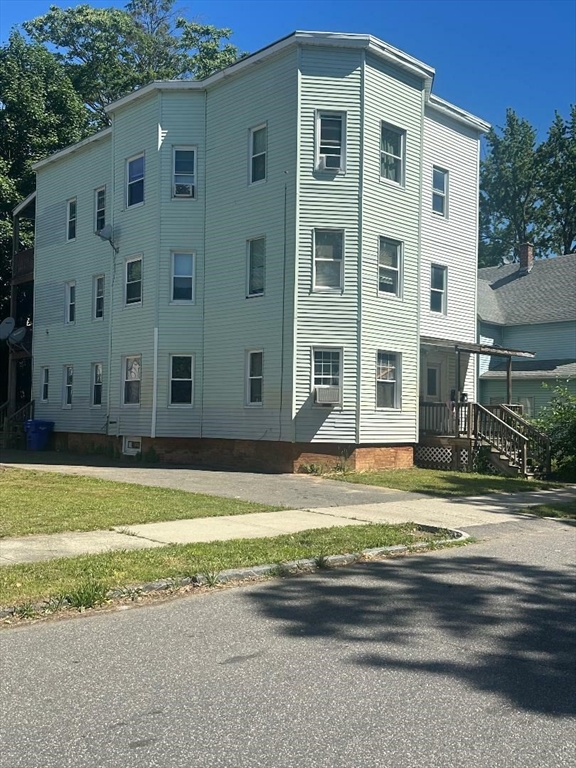 a view of building with yard