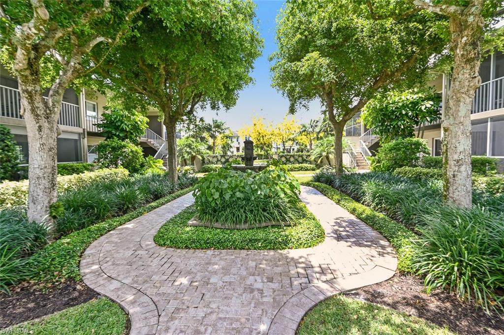 a view of a garden with a fountain