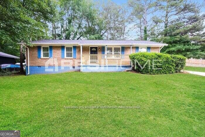 front view of a house with a yard