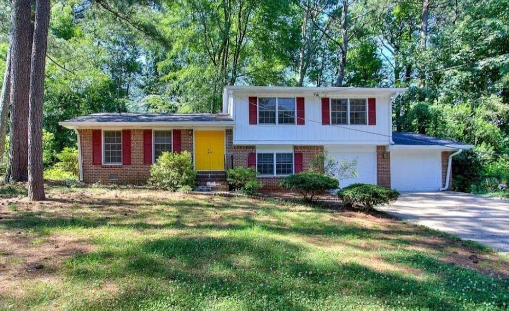 a front view of a house with a yard