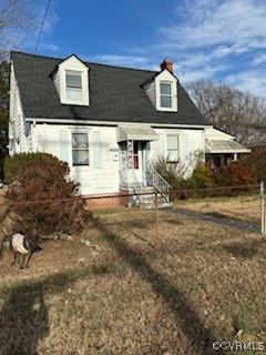 Cape cod home with a front yard