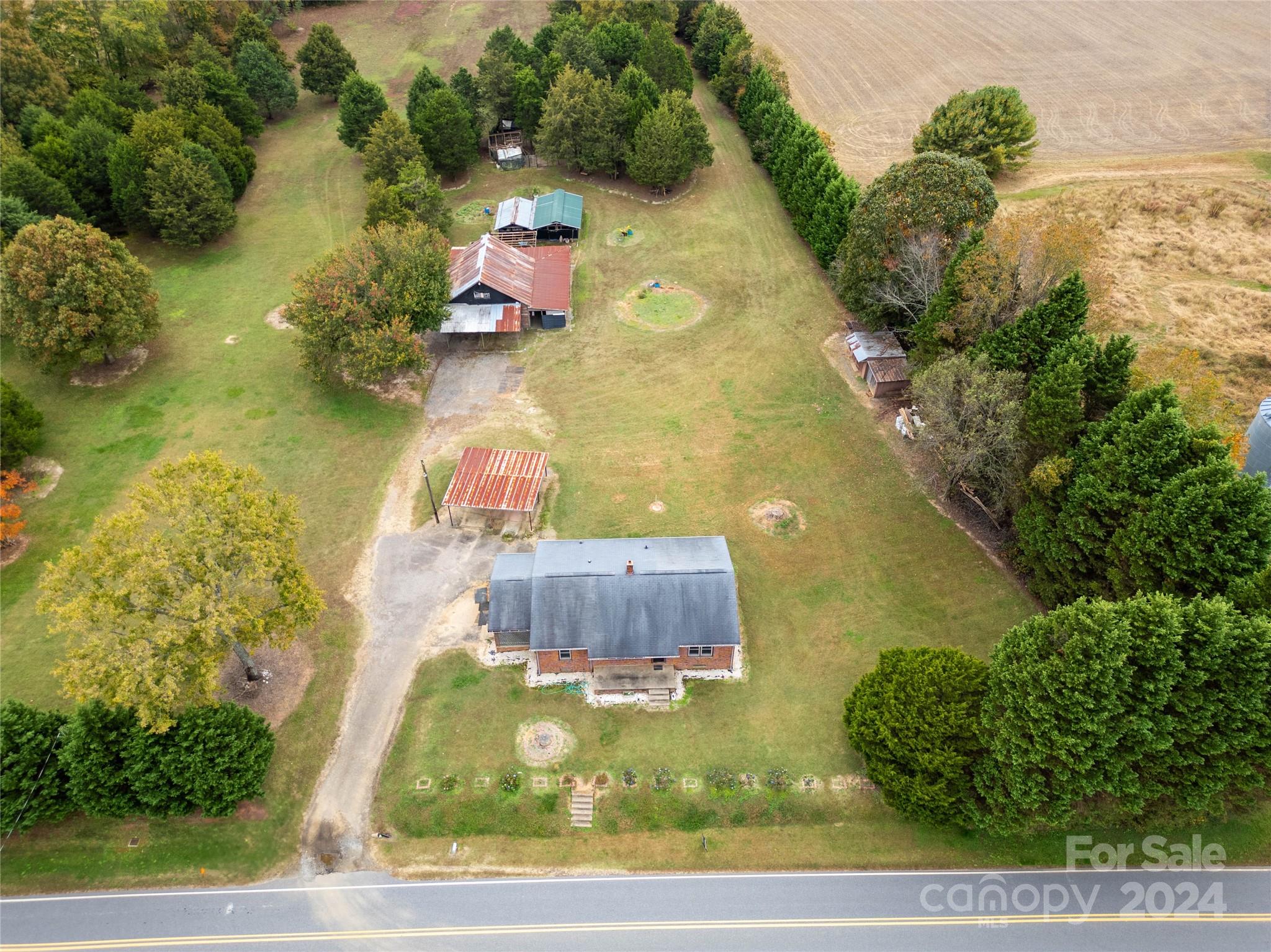 an aerial view of house with yard swimming pool and outdoor seating