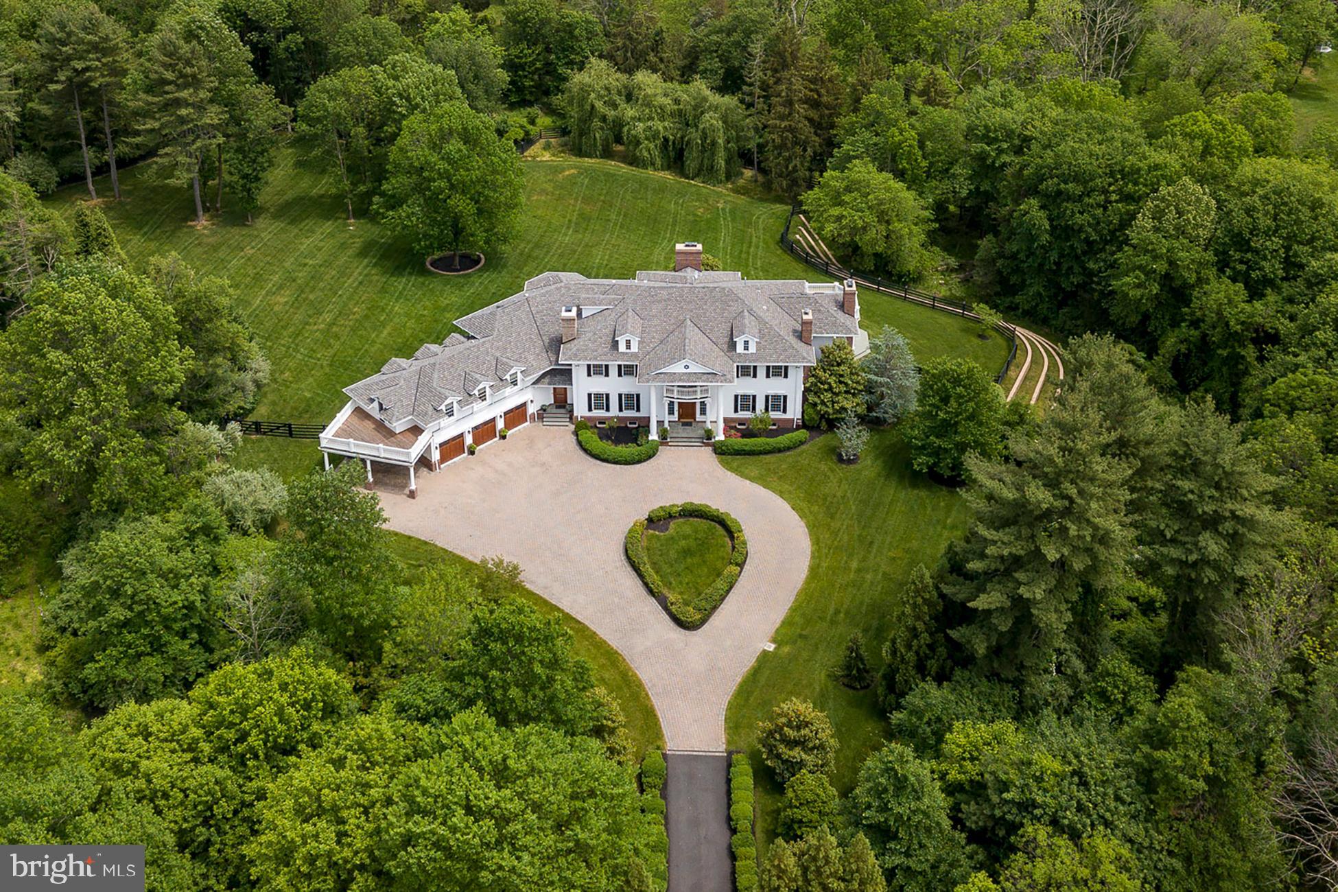 an aerial view of a house with outdoor space and street view