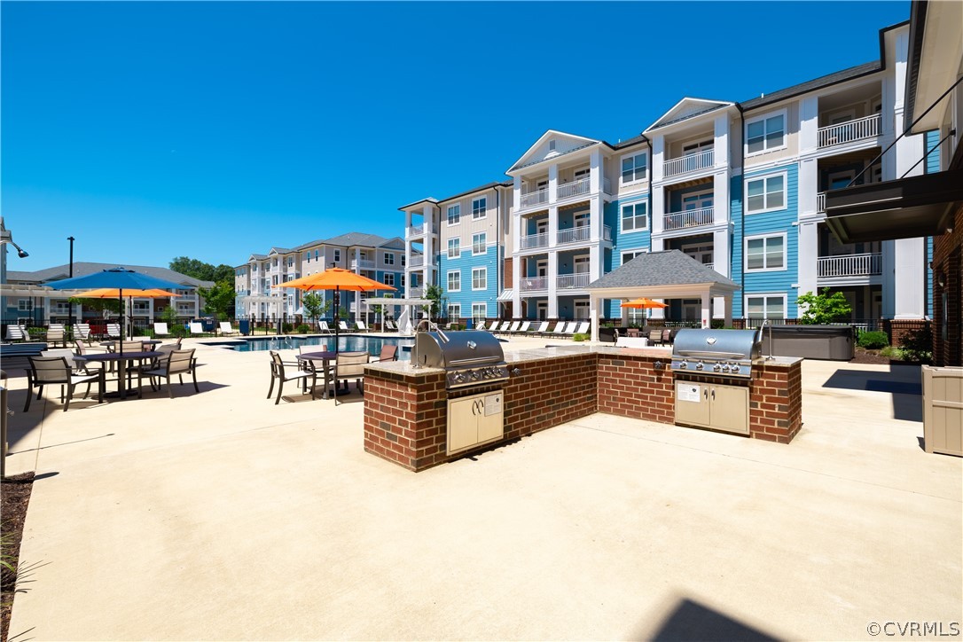 View of patio / terrace featuring a balcony, grill