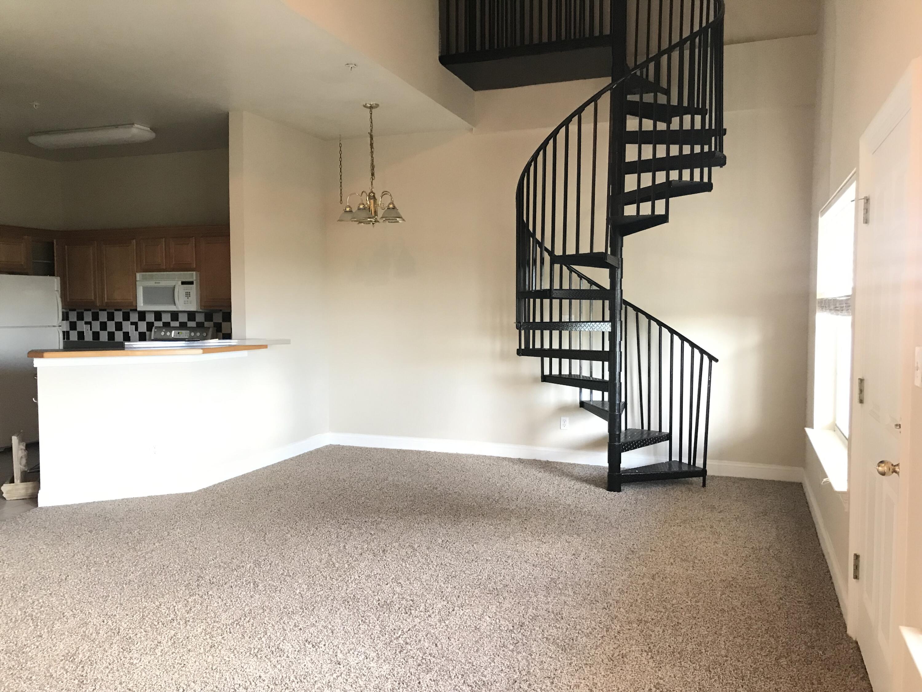 a view of a hallway with staircase