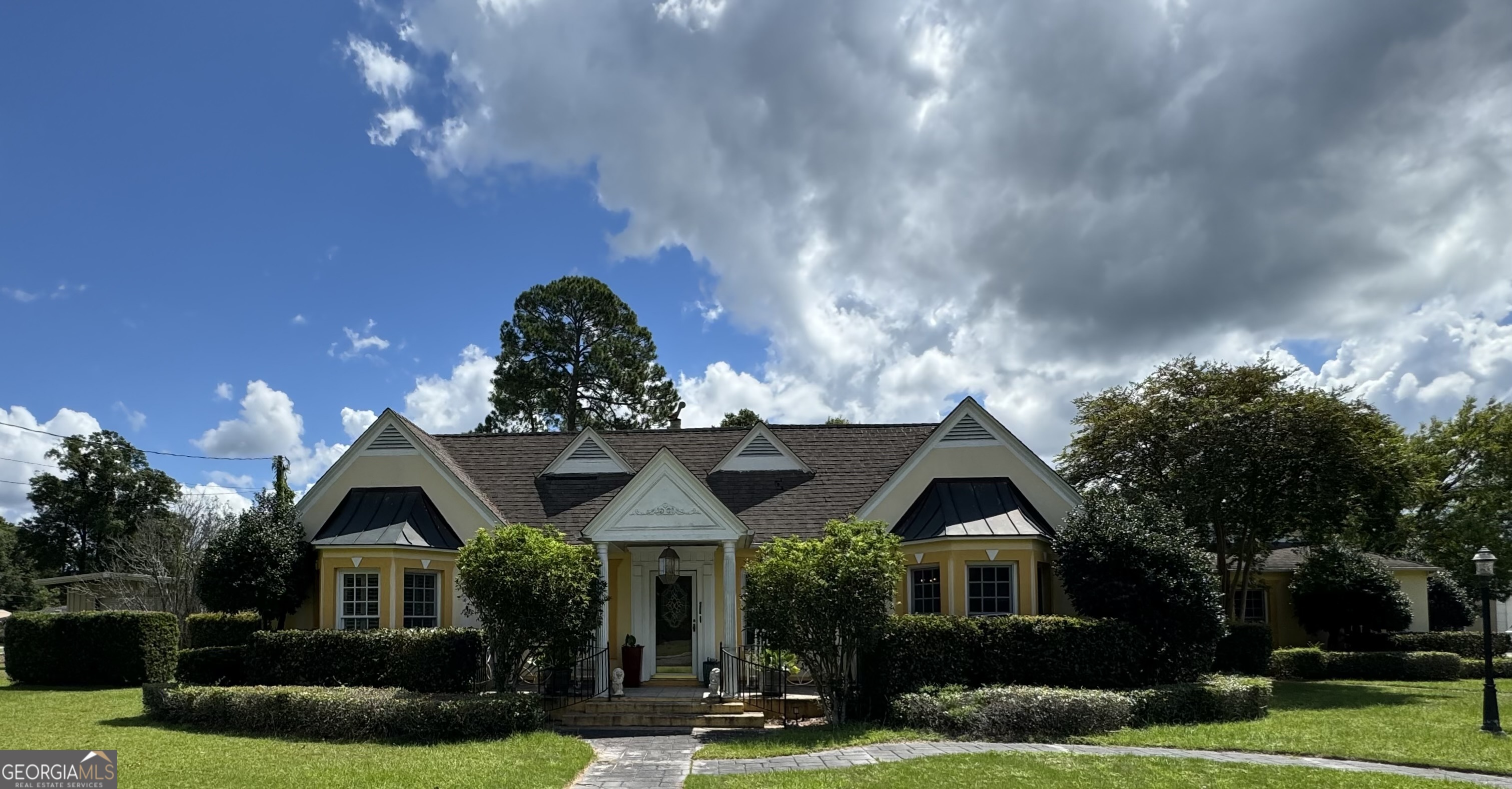 a front view of a house with a yard