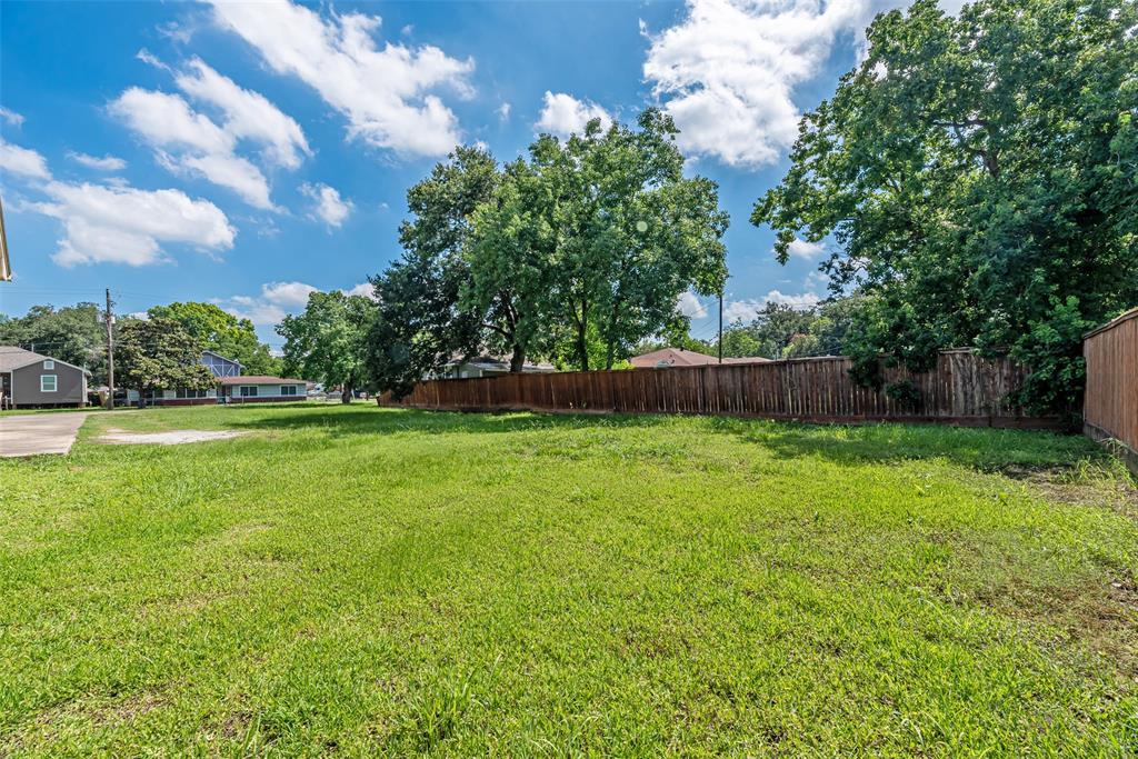 a view of backyard with green space