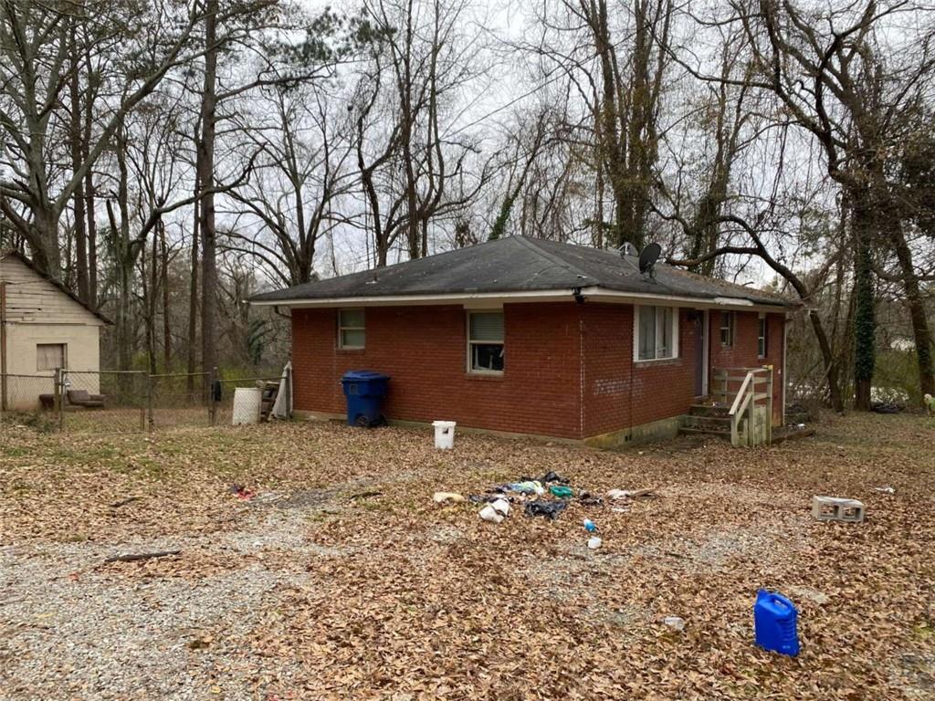 a house with trees in the background