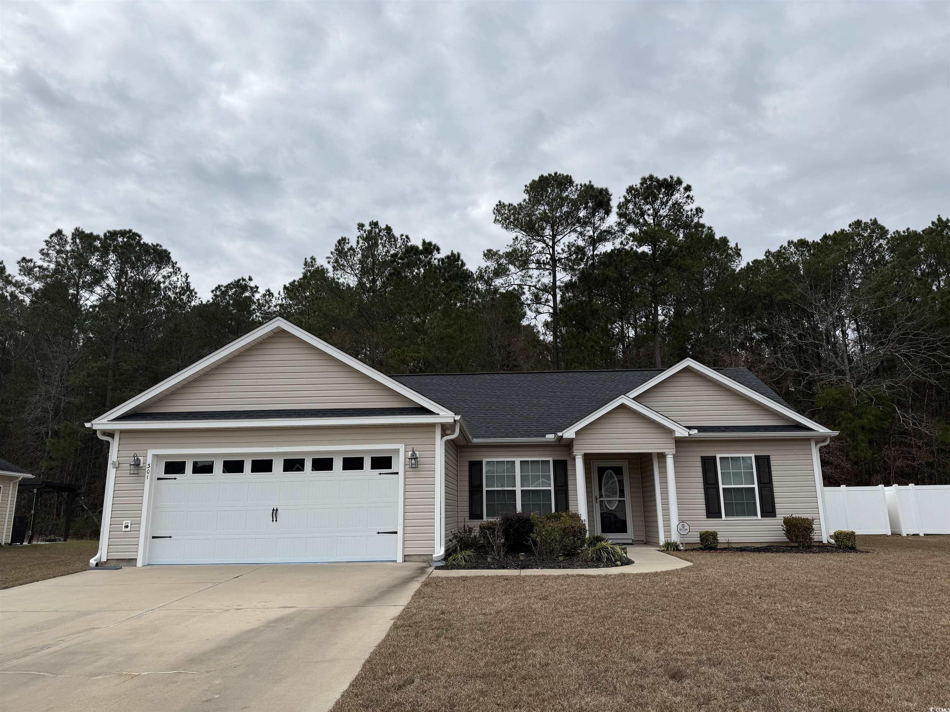 Single story home featuring a garage