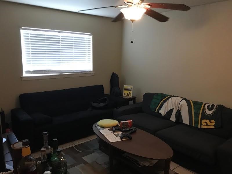 a living room with furniture and a window