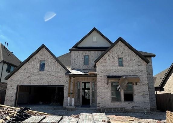 a front view of a house with garage