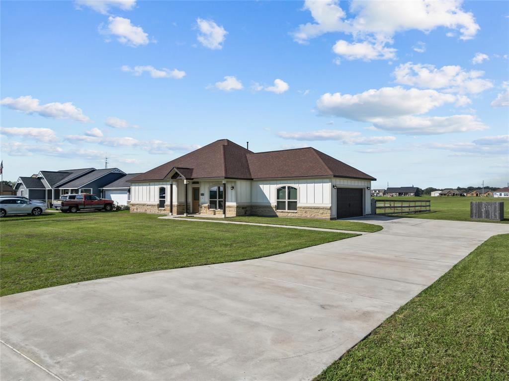 a view of house with outdoor space and street view