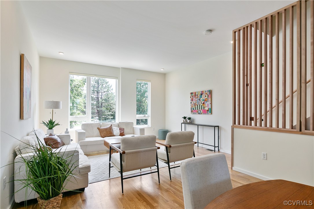 a living room with furniture and a large window