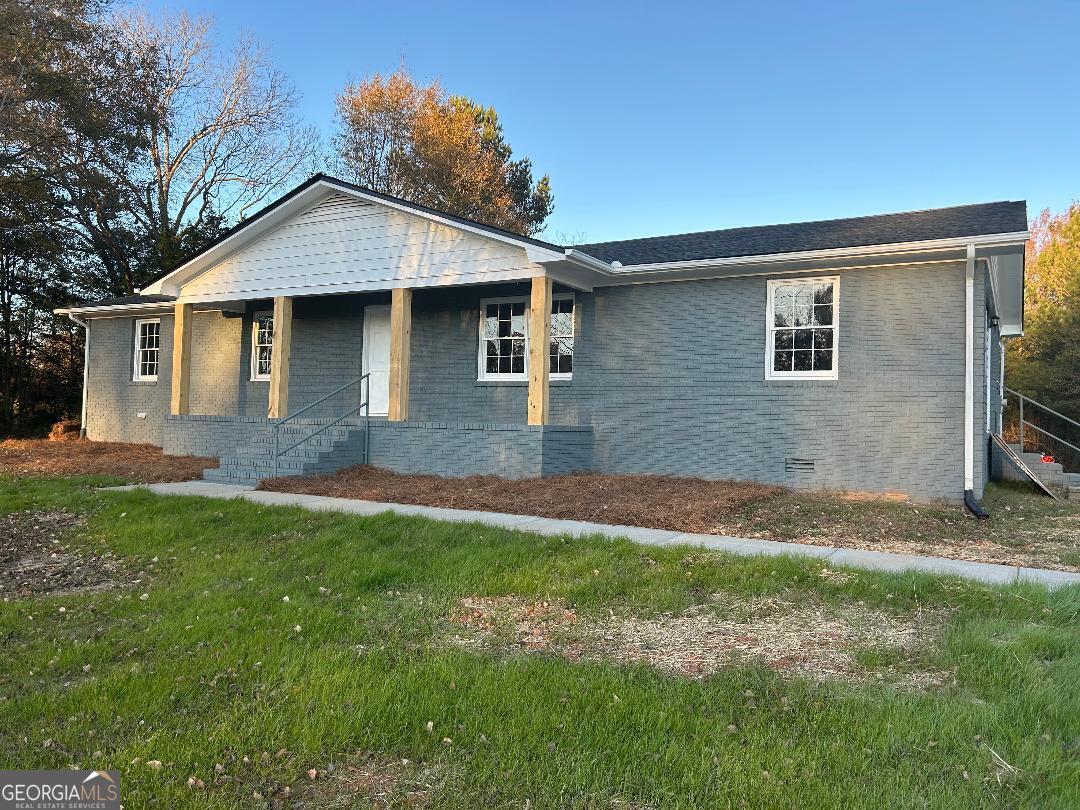 front view of a house with a yard