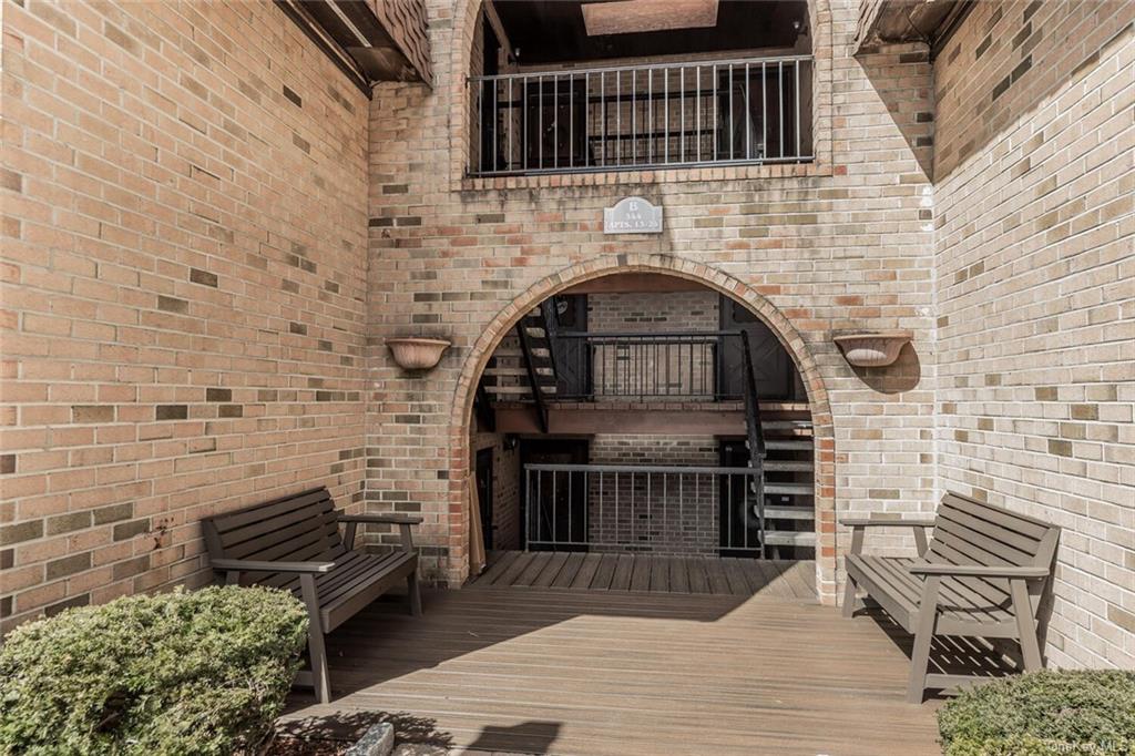 a view of entryway with wooden stairs