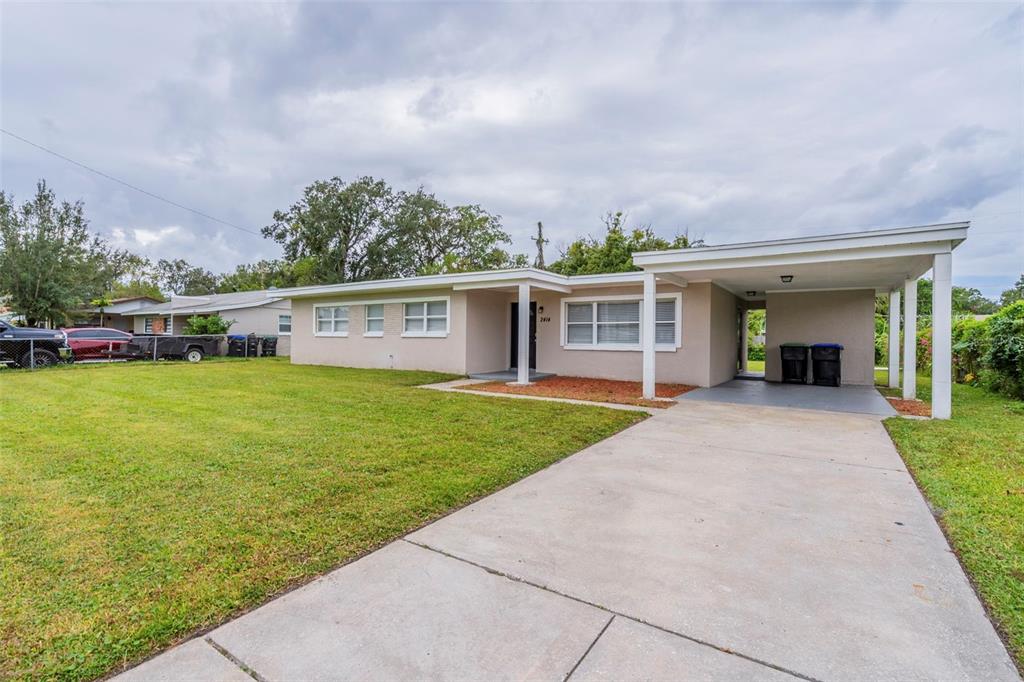 front view of a house with a yard