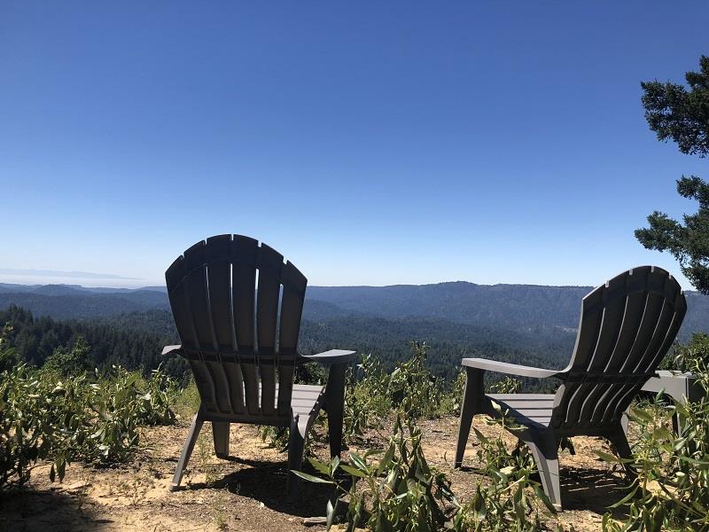 a view of balcony with couple of chairs