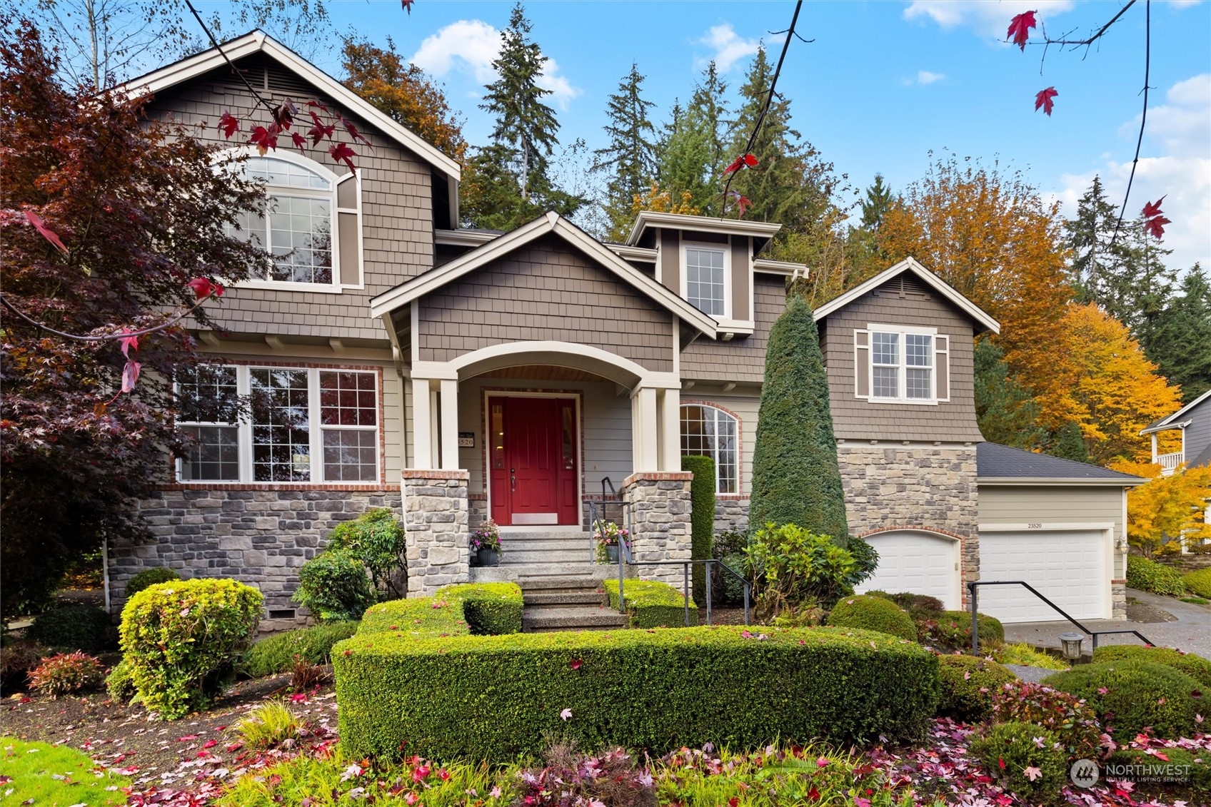 a front view of a house with a yard