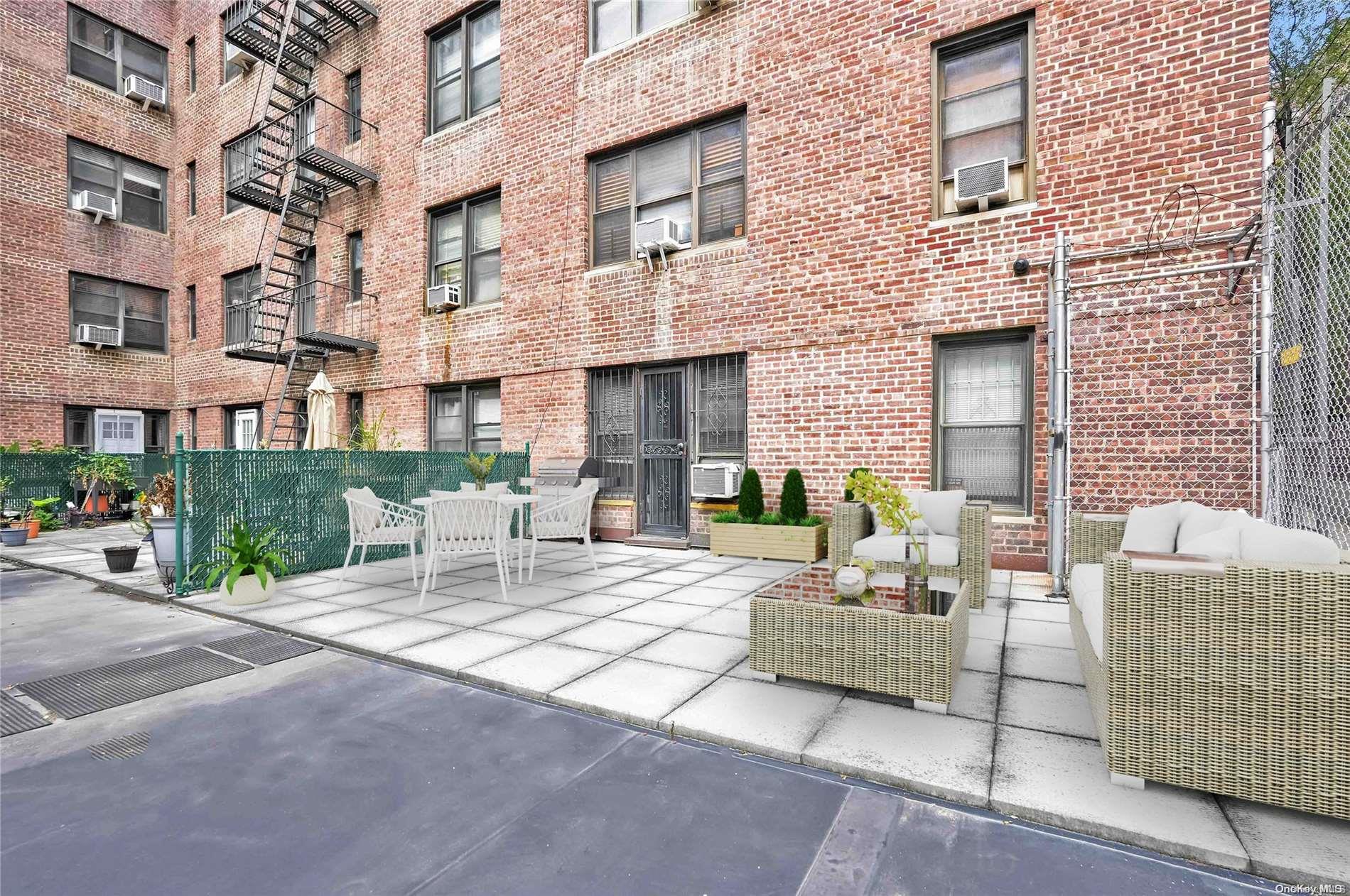 a view of a patio with couches and a table and chairs