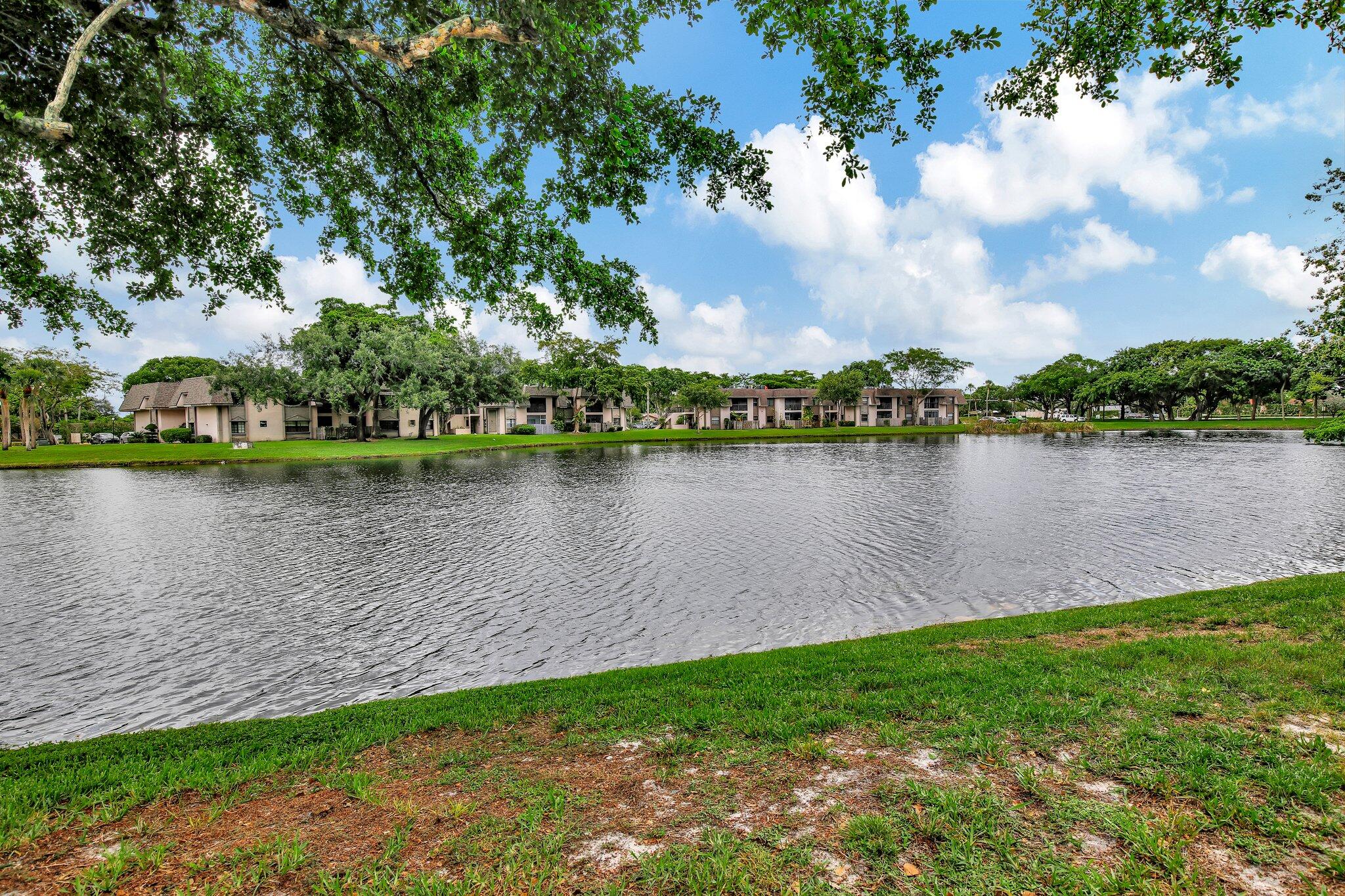 a view of a lake with houses in the back