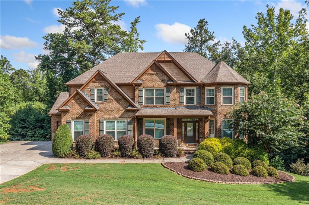 a front view of a house with a yard