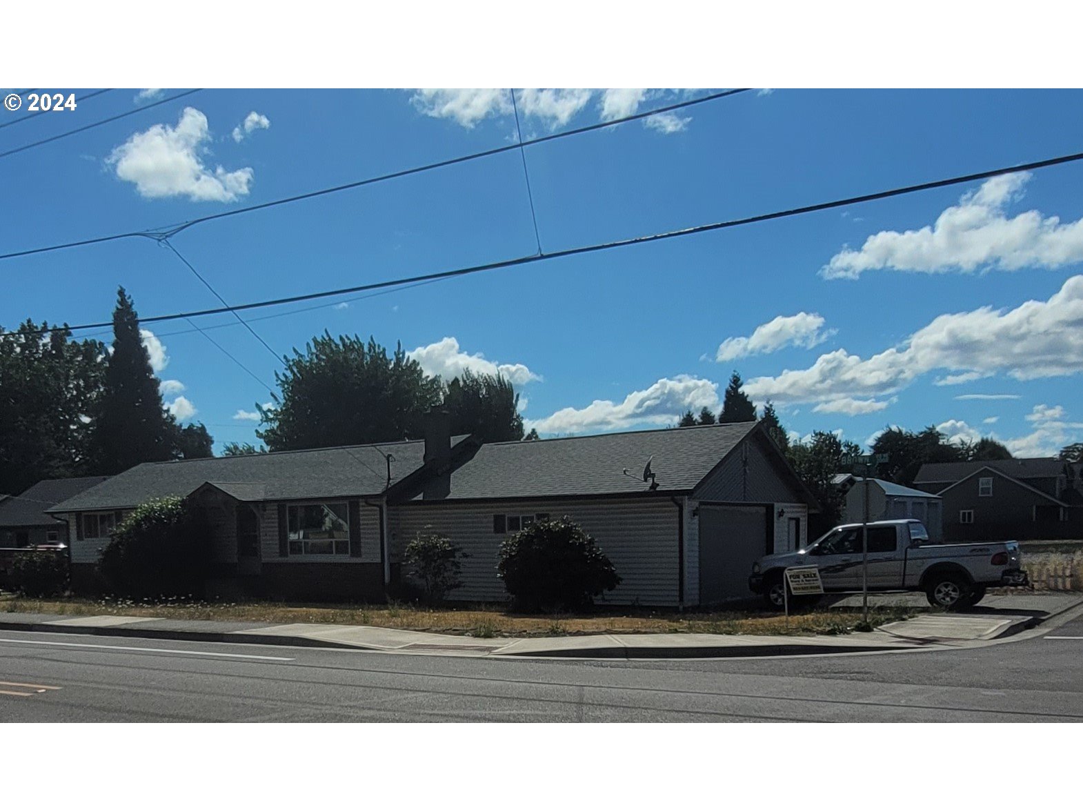 a view of a house with a street