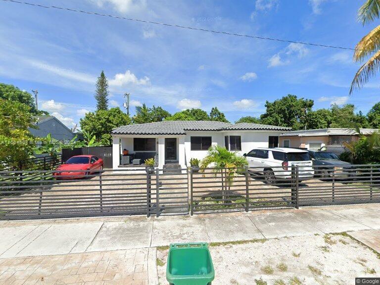 a view of a house and a yard