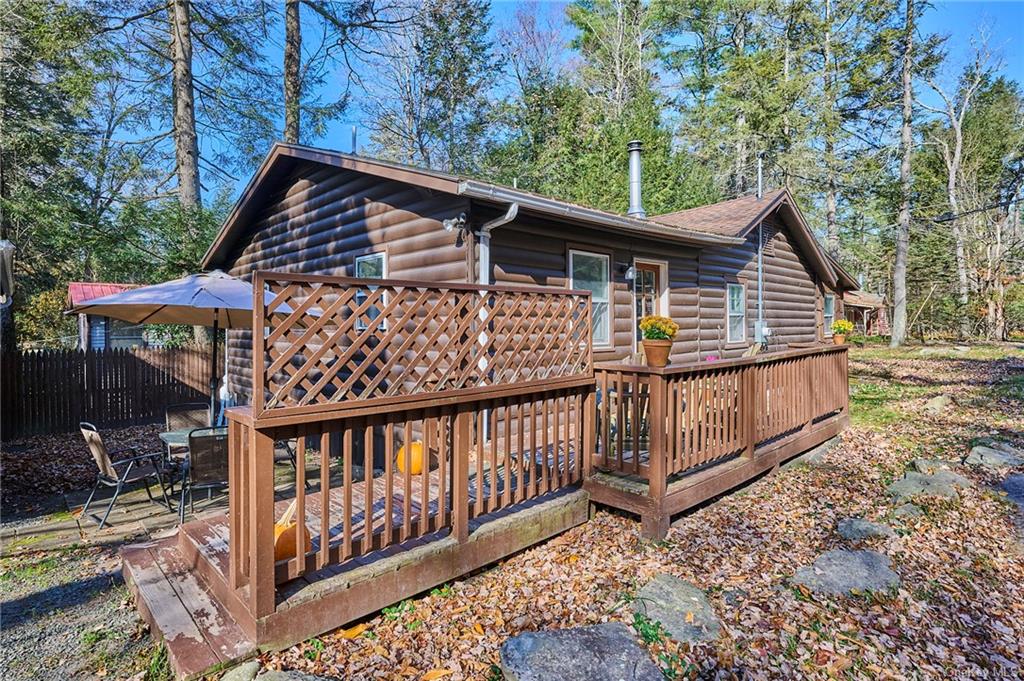 Rear view of property with a wooden deck