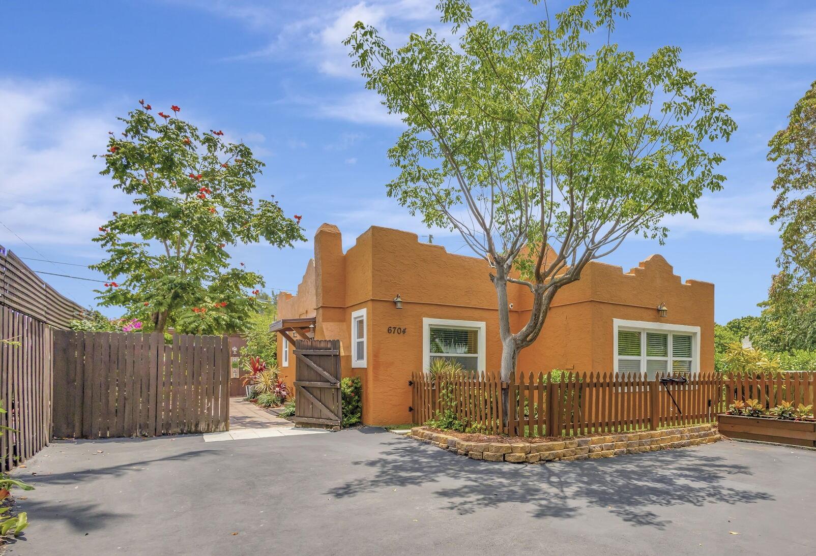 front view of a house with a tree