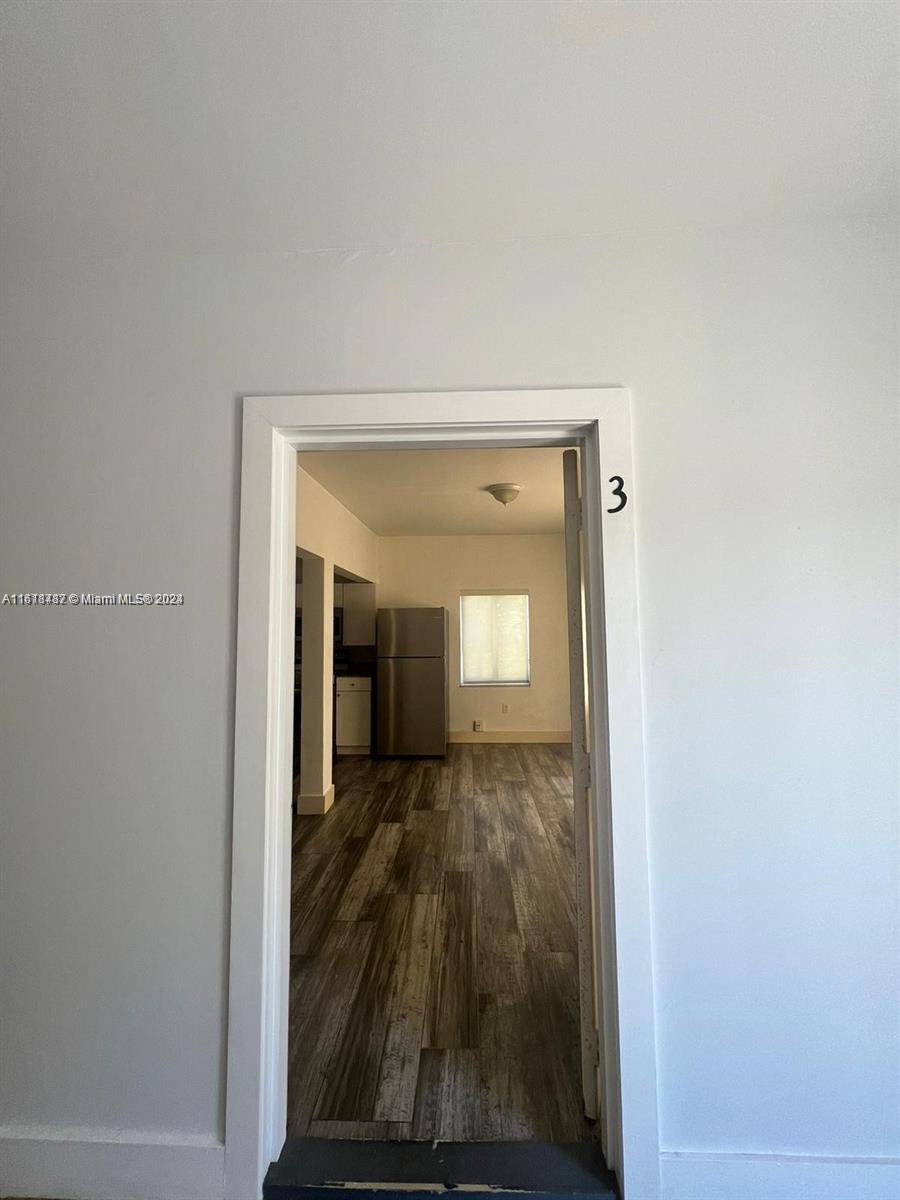 a view of a small space with wooden floor