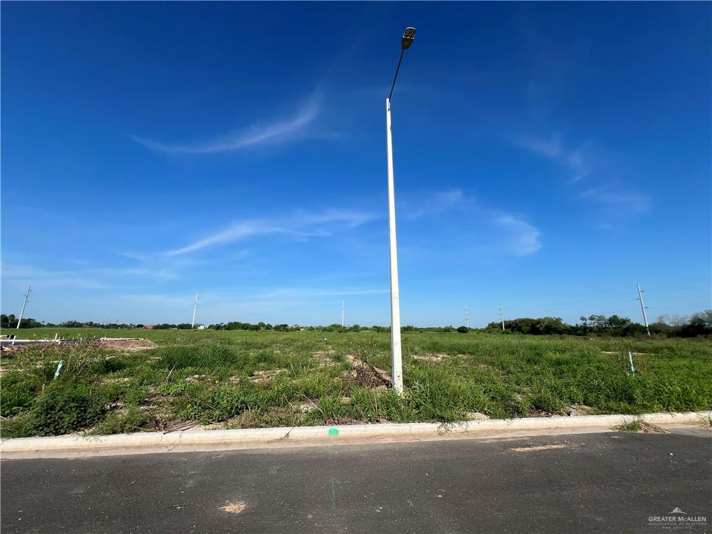 View of yard with a rural view