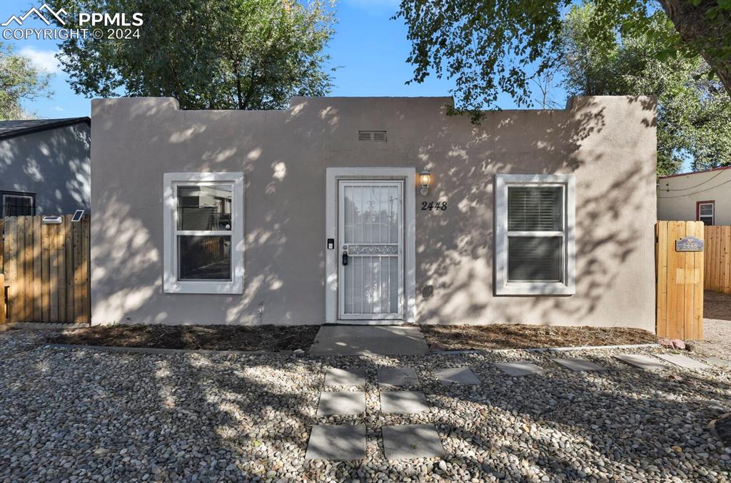 Charming 2 bed 1 bath home with stucco exterior