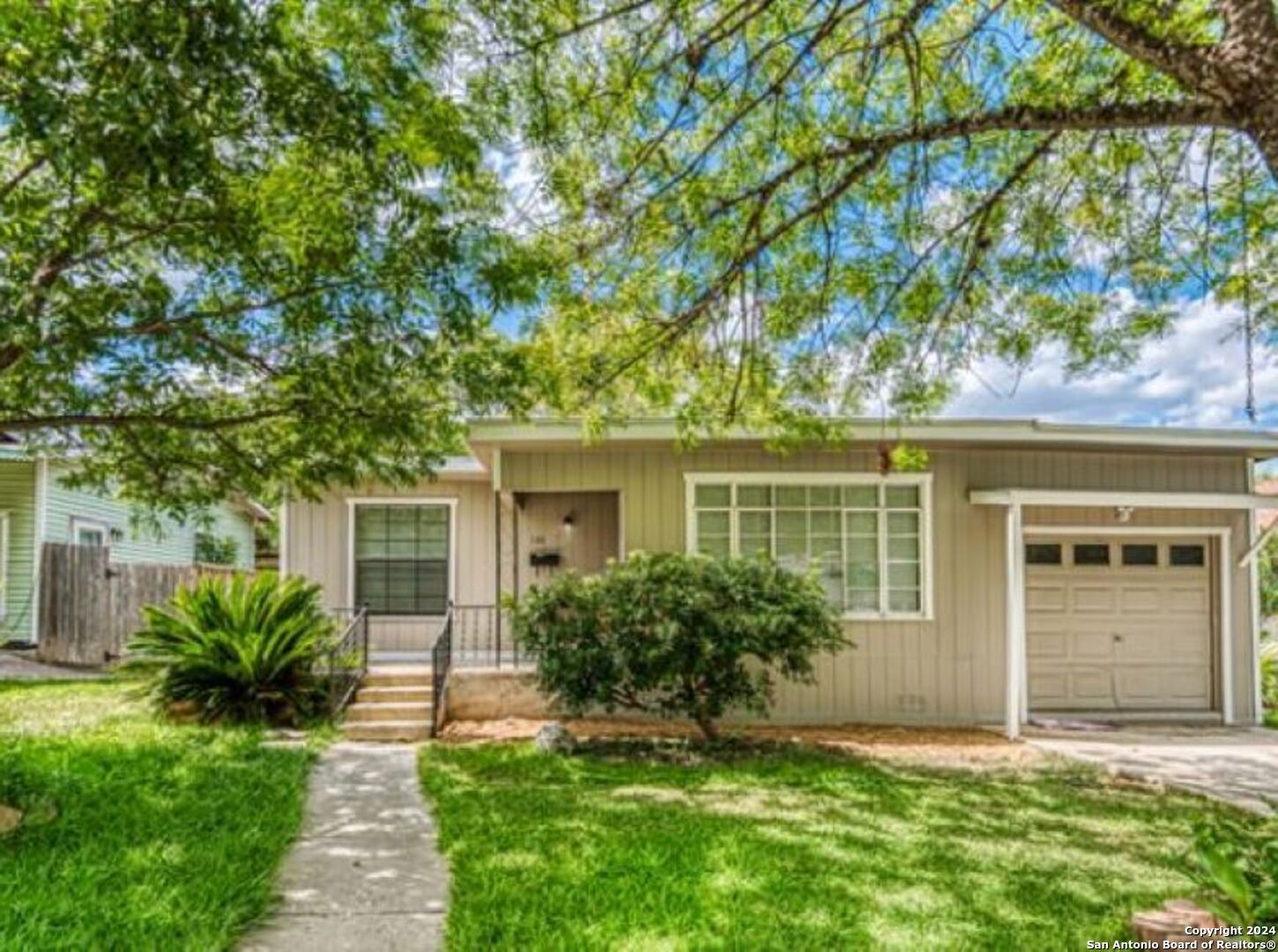 front view of a house with a yard