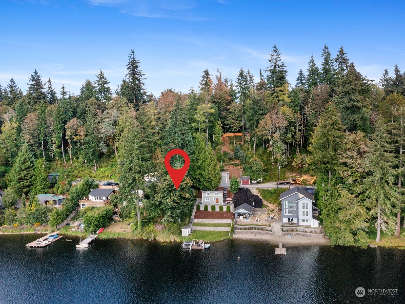 an aerial view of a house with yard swimming pool and outdoor seating