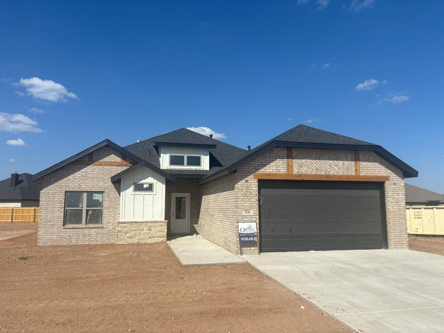 a front view of a house with a garage